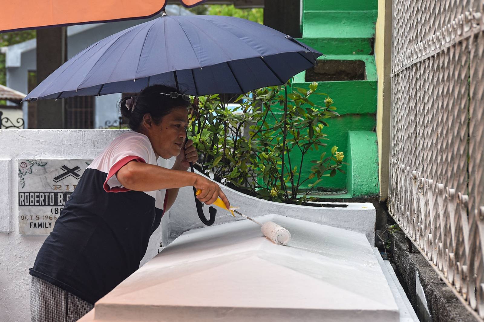 Gravekeepers and caretakers clean and maintain gravestones at the Manila North Cemetery in Manila, on October 24.

The Manila North Cemetery expects around 2 million visitors for this year's Undas. l Zedrich Xylak Madrid