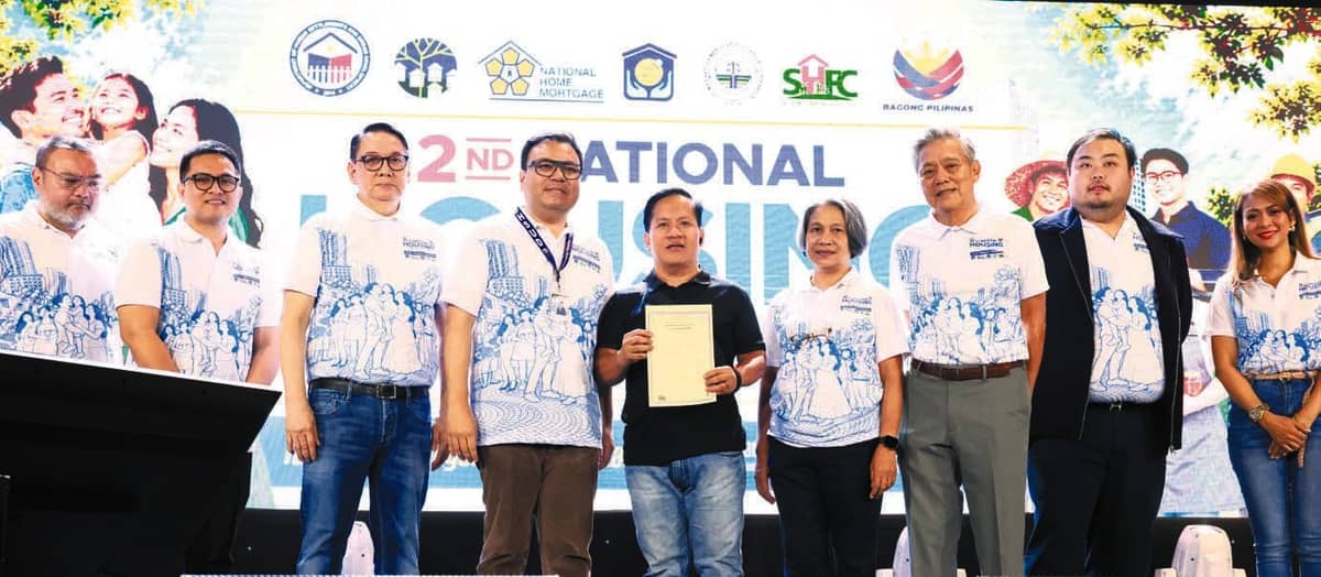 DHSUD Secretary Aliling, together with the KSA heads, awards a land title to an Expanded 4PH beneficiary--turning years of uncertainty into security and peace of mind.