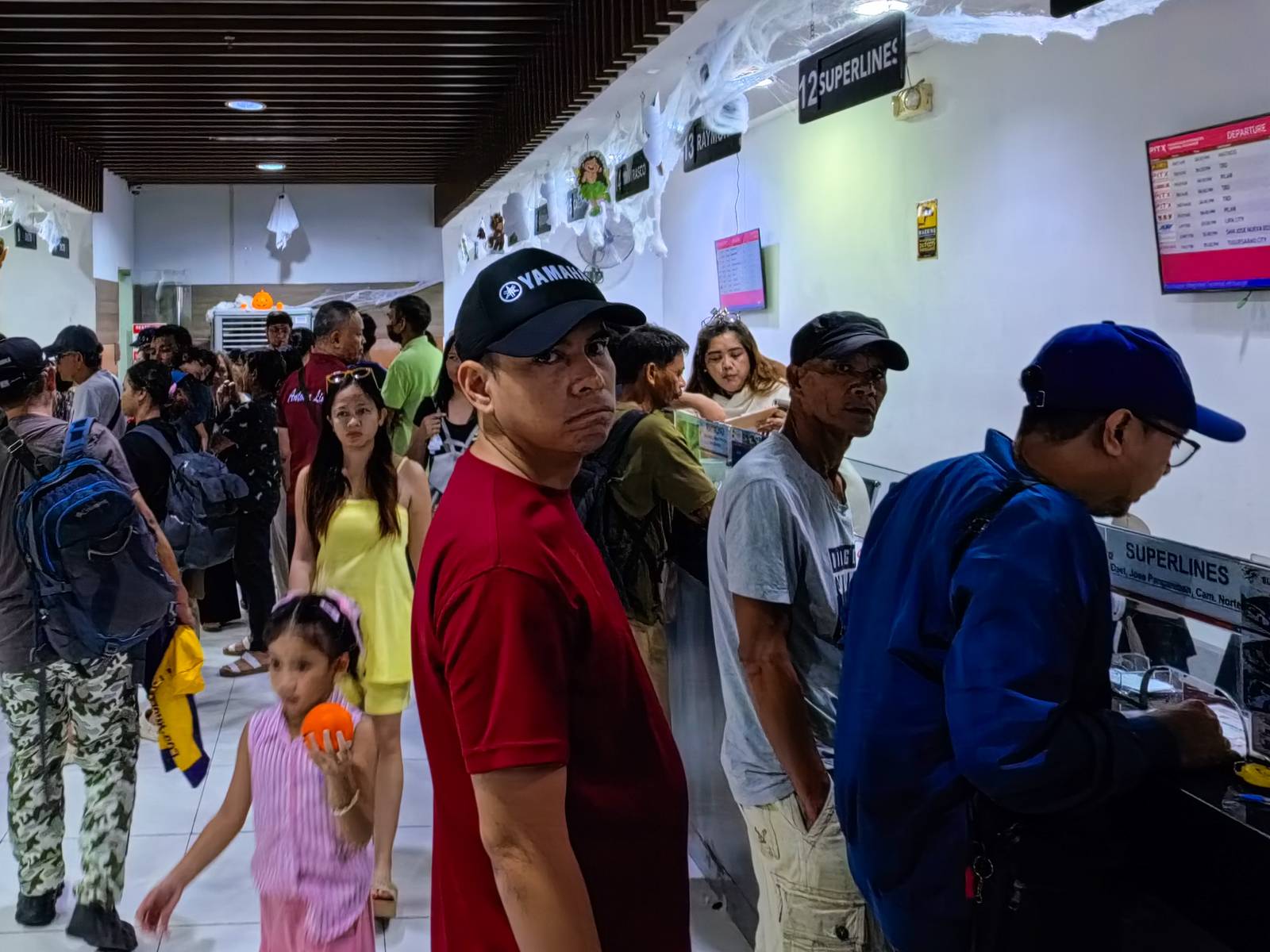 Passengers bound for the provinces flock to the Parañaque Integrated Terminal Exchange (PITX) on 25 October 2026 ahead of the Undas rush, as the Department of Transportation (DOTr) intensifies bus inspections and deploys personnel to ensure safe and orderly travel.