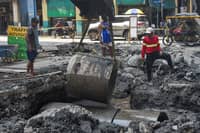 Workers improve drainage system along Yuchengco Street