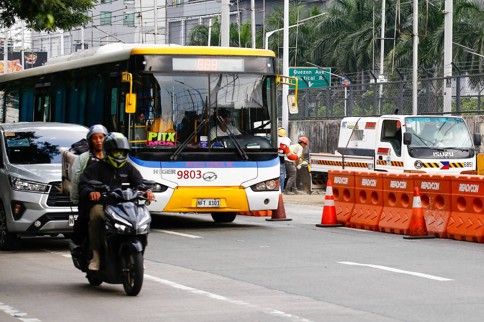 Workers rush to complete road rehabilitation along a portion of the EDSA Bus Carousel southbound lane in Quezon City on 25 October 20265, ahead of the deadline set by the Department of Public Works and Highways (DPWH) for the reopening of the affected section at 5 a.m. on 26 October 2026.