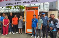 FORMER Senator Cynthia Villar cuts the ceremonial ribbon during a turnover ceremony for a portable toilet at the tricycle terminal of the BFRSSCV-TODA Blue in Talon Dos, Las Piñas City.