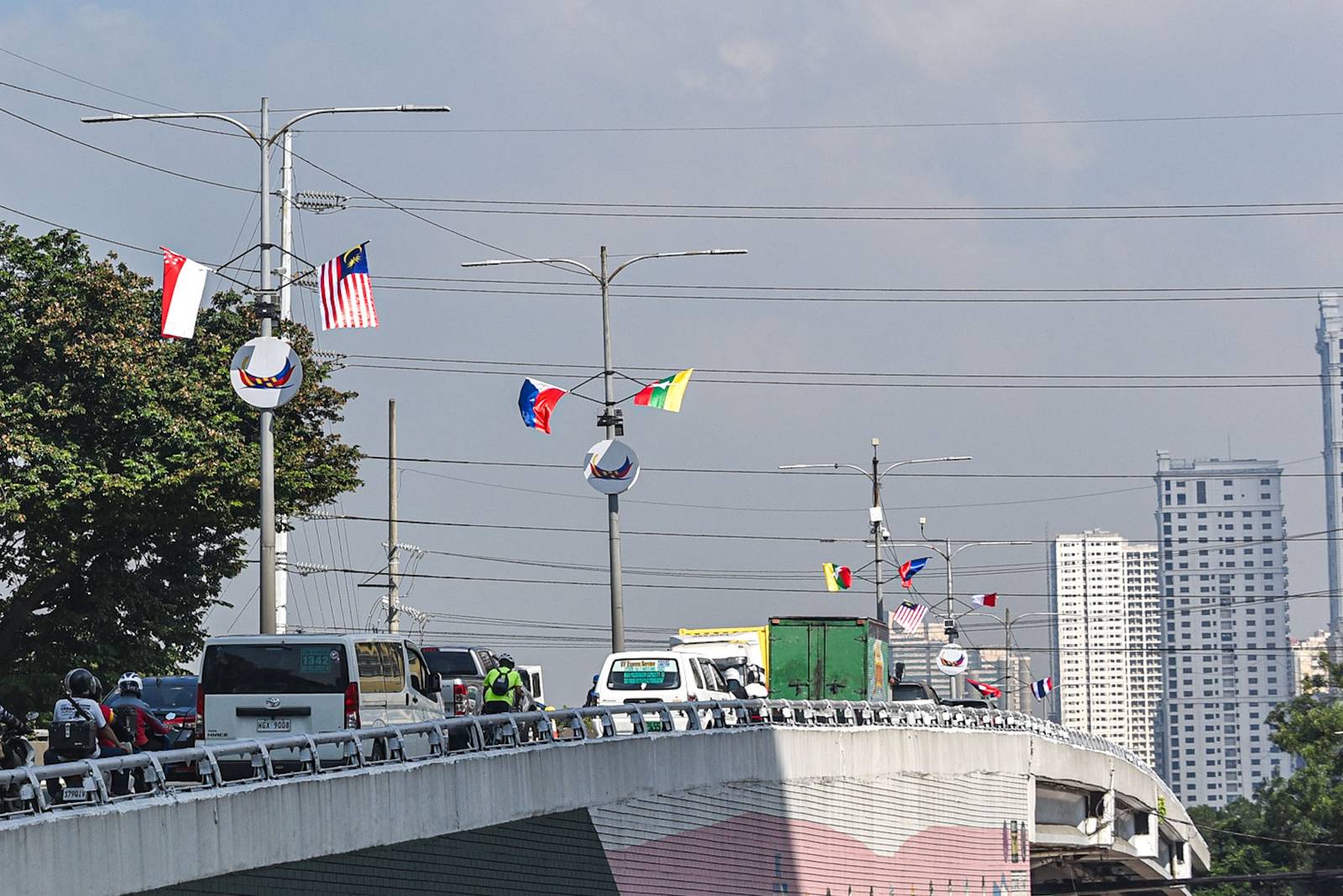 Flags of ASEAN member states are displayed along a flyover leading to Roxas Boulevard in Manila on October 26.

The preparations are for the upcoming ASEAN Summit, which will be held at the Philippine International Convention Center. | Zedrich Xylak Madrid