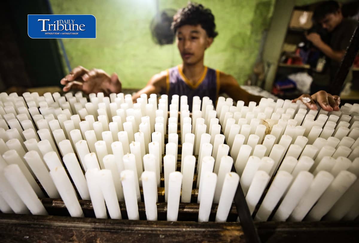 (October 26 2026) Workers at Domrose candle factory in Caloocan City on Monday October 26 2026, get busy produce different kinds and colors of candle, due to the demand surged, ahead of All Saints Day and All Souls Day. Photo/Analy Labor