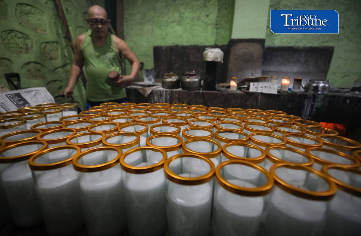 (October 26 2026) Workers at Domrose candle factory in Caloocan City on Monday October 26 2026, get busy produce different kinds and colors of candle, due to the demand surged, ahead of All Saints Day and All Souls Day. Photo/Analy Labor