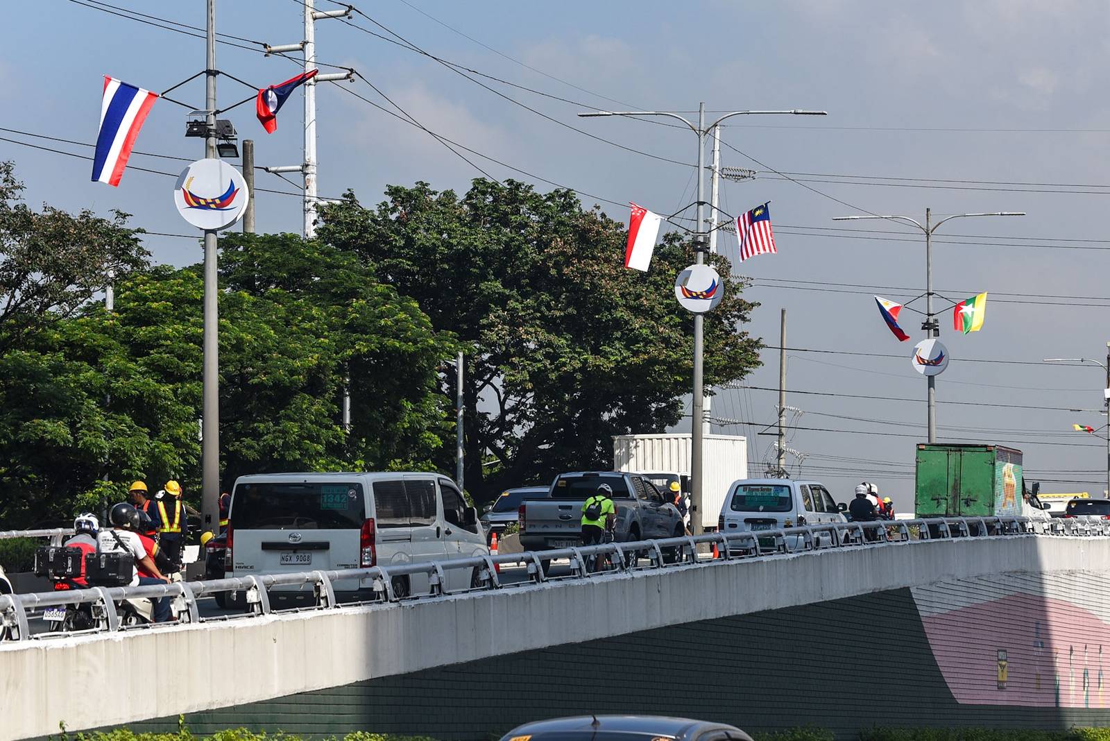 Flags of ASEAN member states are displayed along a flyover leading to Roxas Boulevard in Manila on October 26.

The preparations are for the upcoming ASEAN Summit, which will be held at the Philippine International Convention Center. | Zedrich Xylak Madrid