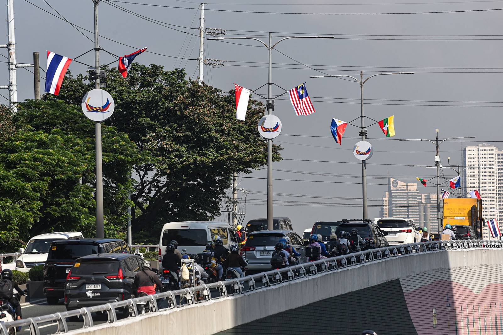 Flags of ASEAN member states are displayed along a flyover leading to Roxas Boulevard in Manila on October 26.

The preparations are for the upcoming ASEAN Summit, which will be held at the Philippine International Convention Center. | Zedrich Xylak Madrid