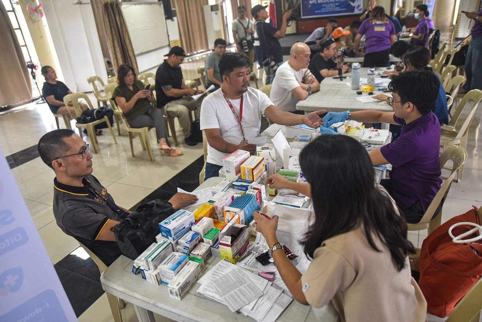 Members of the media and their relatives receive medical services during a medical mission organized by the National Press Club of the Philippines (NPC), in partnership with the Department of Health (DOH) and Lifesaver, in Intramuros, Manila, on October 26.

The medical mission coincides with the NPC’s 74th founding anniversary. | Zedrich Xylak Madrid