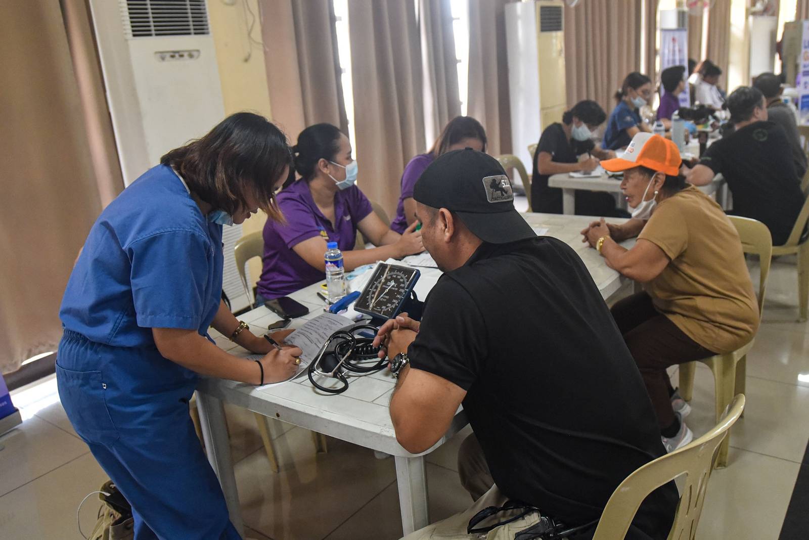 Members of the media and their relatives receive medical services during a medical mission organized by the National Press Club of the Philippines (NPC), in partnership with the Department of Health (DOH) and Lifesaver, in Intramuros, Manila, on October 26.

The medical mission coincides with the NPC’s 74th founding anniversary. | Zedrich Xylak Madrid