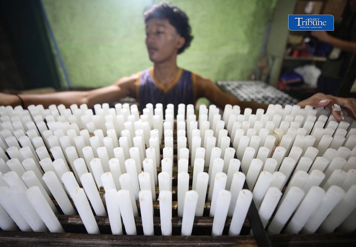 (October 26 2026) Workers at Domrose candle factory in Caloocan City on Monday October 26 2026, get busy produce different kinds and colors of candle, due to the demand surged, ahead of All Saints Day and All Souls Day. Photo/Analy Labor