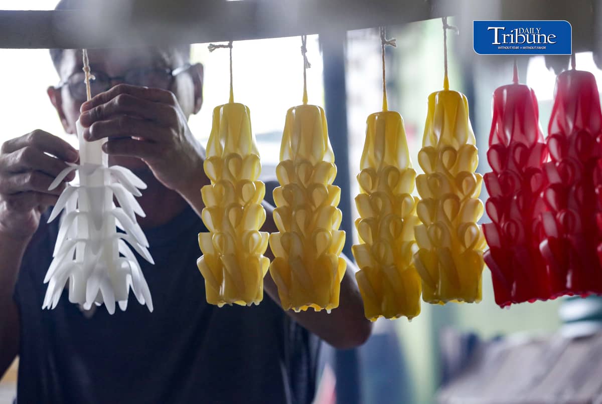 (October 26 2026) Workers at Domrose candle factory in Caloocan City on Monday October 26 2026, get busy produce different kinds and colors of candle, due to the demand surged, ahead of All Saints Day and All Souls Day. Photo/Analy Labor