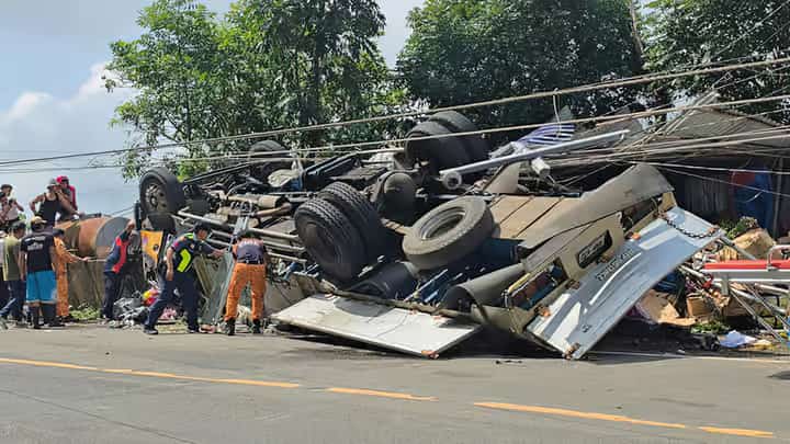 EMERGENCY responders inspect the wreckage of an Isuzu Forward truck that lost its brakes and crashed into a residential home along Marcos Highway in Taloy Sur Proper, Tuba, Benguet, on Tuesday. The morning incident left three men injured and caused significant structural damage to the residence.