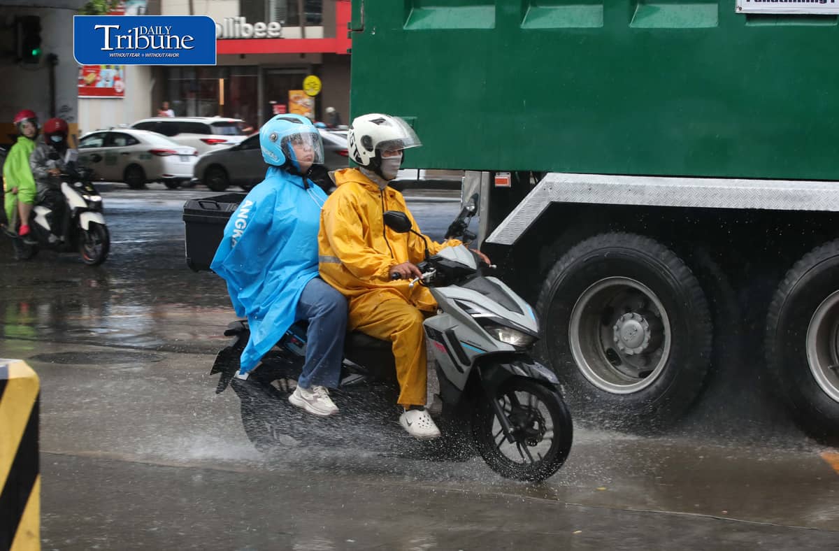 (October 27 2026) Pedestrian and Motorcycle rider use protective gear, due to suddenly heavy downpour happen in Tuesday October 27 2026 in Quezon City. The Philippine Atmospheric, Geophysical and Astronomical Services Administration (PAGASA) weather bureau announced on Tuesday that the northeast monsoon or “amihan” season has officially started, and brings cooler temperatures, stronger winds, and occasional rains. Photo/Analy Labor