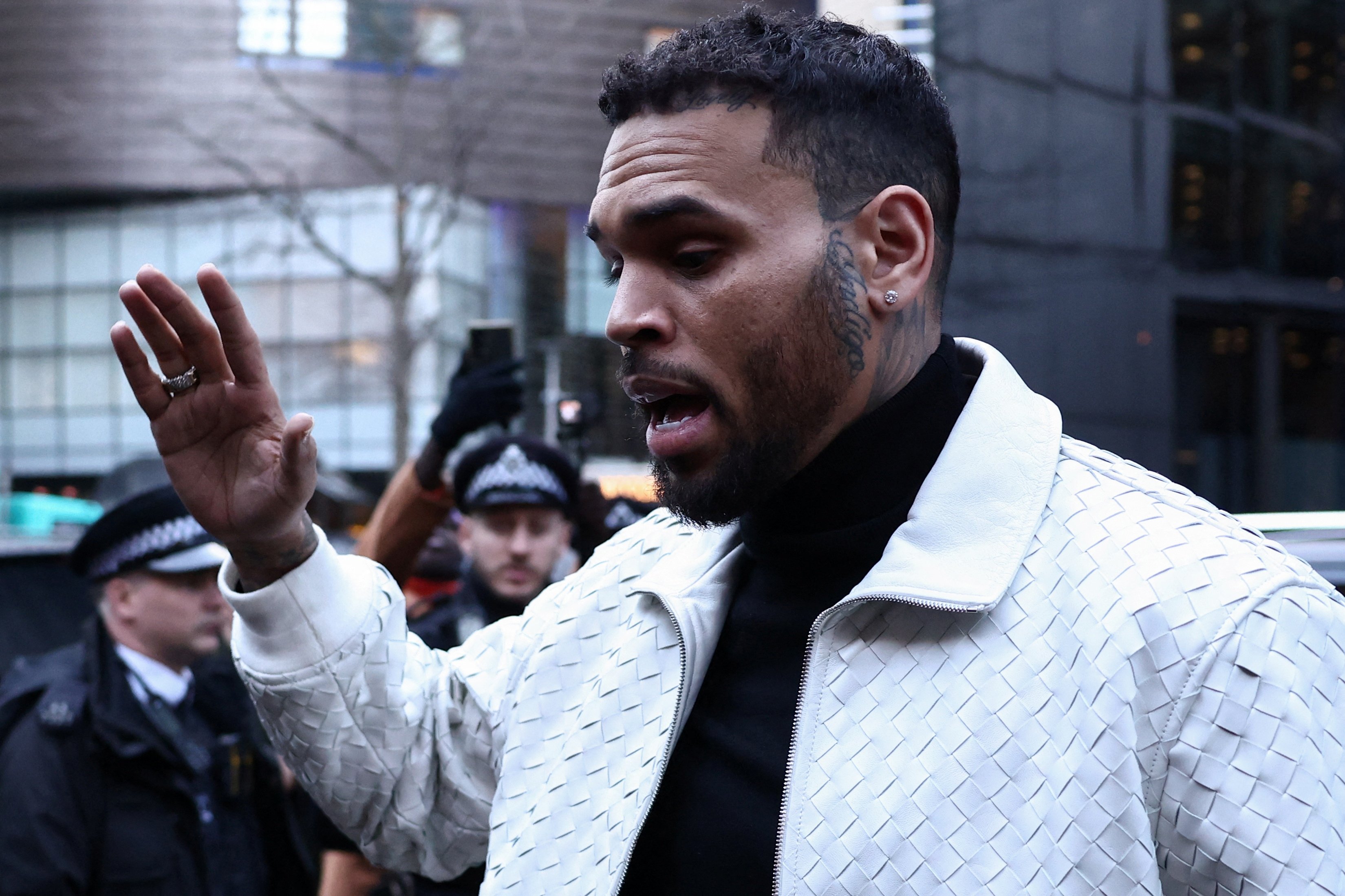 US singer Chris Brown avoids jail over London nightclub brawl