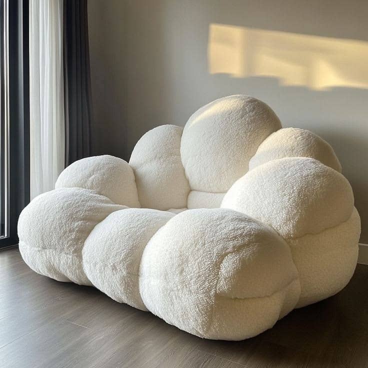OVERSTUFFED white cloud-shaped or bubble lounge armchair upholstered in soft textured lamb fleece/bouclé fabric.