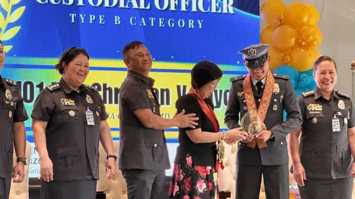 SERVICE RECOGNIZED. A jail officer receives the Best Custodial Officer award under the Type B category during the Gawad Penolohiya 2026 ceremony in Calamba City, Laguna, on 28 October. BJMP CALABARZON honored 57 personnel and 13 jail units for outstanding service.