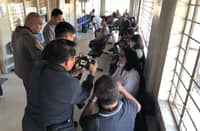 Members of the two farmer associations being interviewed by the media in Gapan City Regional Trial Court on 28 October 2026.