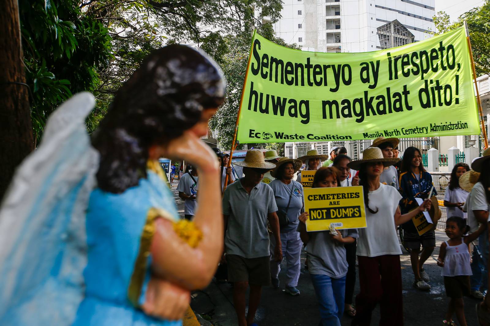 Members of the EcoWaste Coalition gather at the Manila North Cemetery on 29 October 2026 to reiterate their call for an eco-friendly and zero-waste observance of Undas.