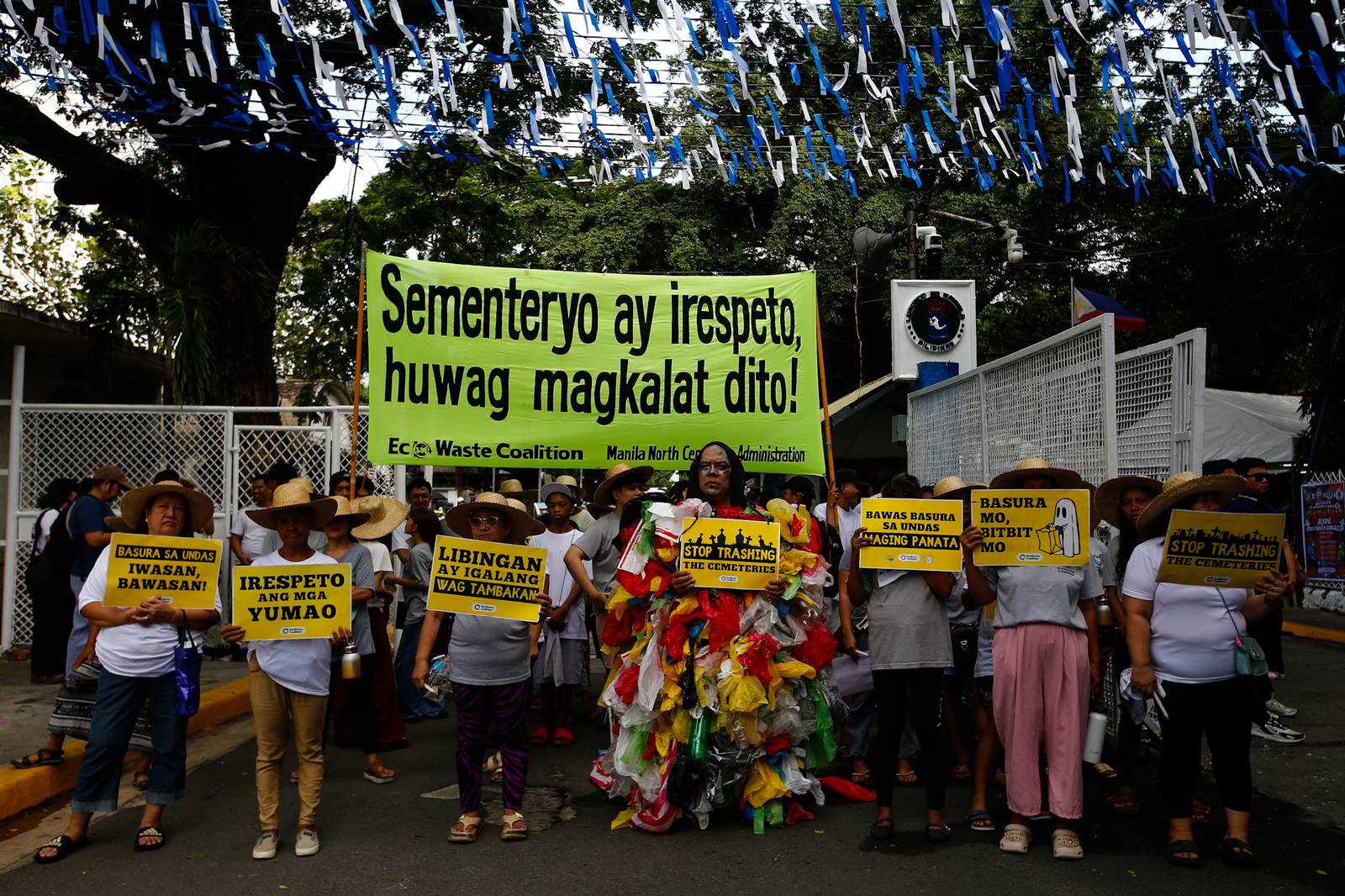 Members of the EcoWaste Coalition gather at the Manila North Cemetery on 29 October 2026 to reiterate their call for an eco-friendly and zero-waste observance of Undas.