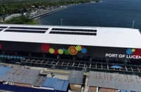An aerial view of the upgraded Port of Lucena passenger terminal in Quezon province shows its solar-panel installation and expanded facilities. The Philippine Ports Authority has highlighted the terminal's readiness to accommodate travelers during the Undas 2026 holiday period.