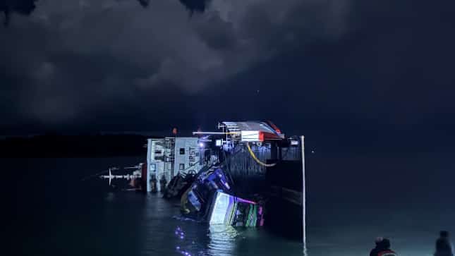 A roll-on/roll-off vessel lies tilted at Ungos Port in Real, Quezon, following an incident early Friday, 30 October. Four people sustained minor injuries.