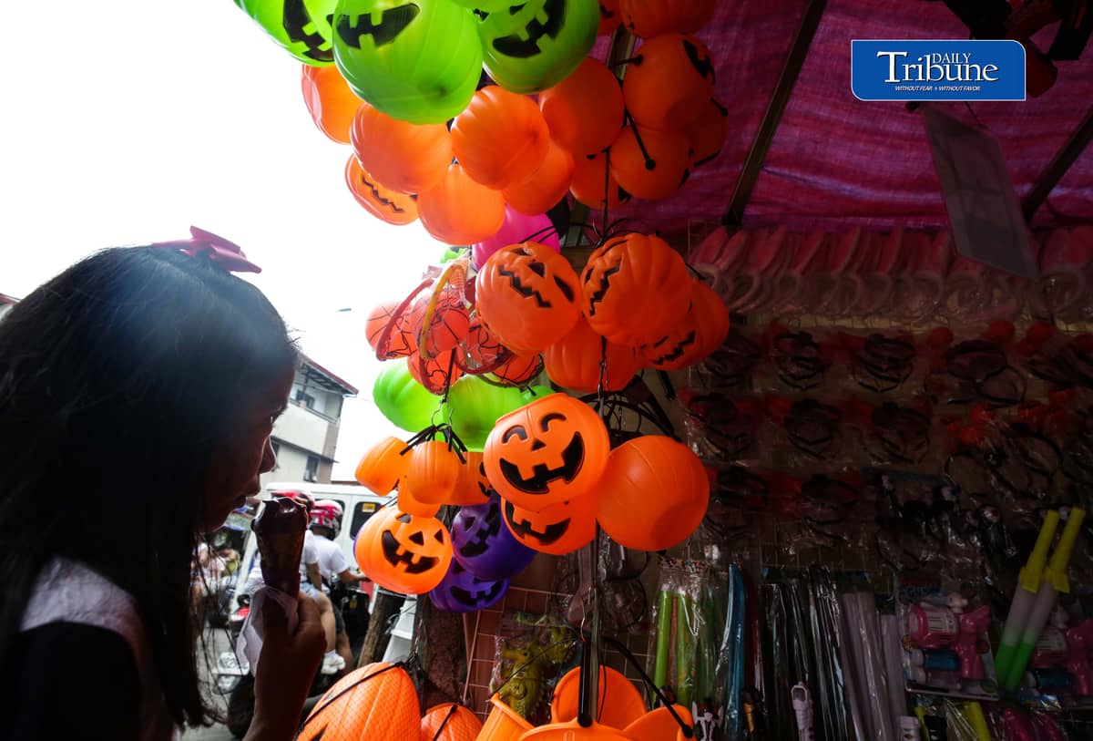 Vendors tend their customers buying Halloween trick or treat baskets for their kids to use for Halloween celebrations, observed annually on 31 October, dedicated to remembering the dead, before the All Saints Day and All Souls Day celebration.