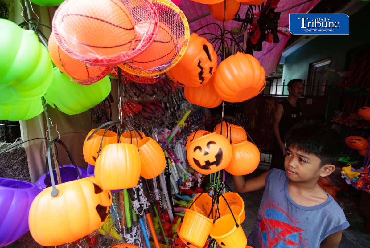 Vendors tend their customers buying Halloween trick or treat baskets for their kids to use for Halloween celebrations, observed annually on 31 October, dedicated to remembering the dead, before the All Saints Day and All Souls Day celebration.