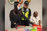 AUTHORITIES at NAIA Terminal 3 present the American passenger who was caught with 17.46 kilograms of seized marijuana kush worth P17.46 million after arriving from Bangkok, Thailand.