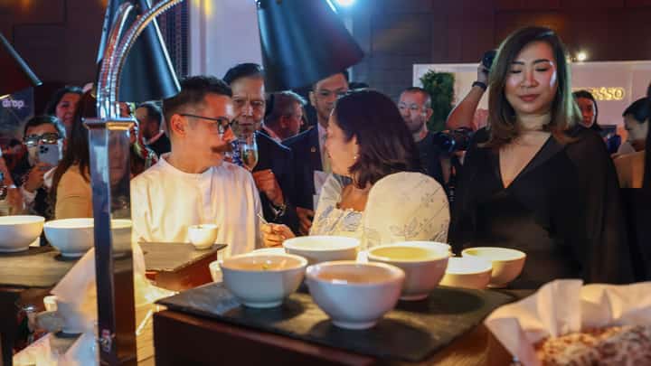 FILIPINO chef briefs First Lady Liza Araneta-Marcos (center) after she samples a restaurant’s cuisine during the formal announcement of the 2027 Michelin Guide at the Manila Marriott Hotel in Pasay City on Thursday.