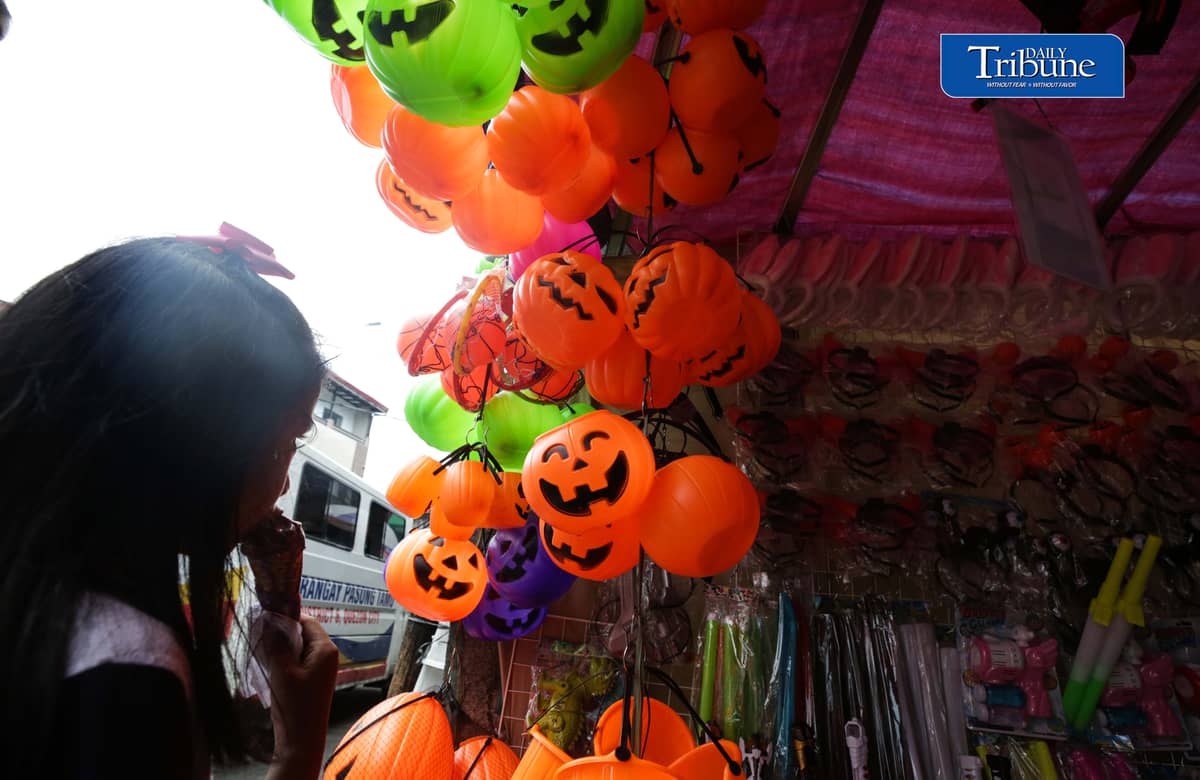 Vendors tend their customers buying Halloween trick or treat baskets for their kids to use for Halloween celebrations, observed annually on 31 October, dedicated to remembering the dead, before the All Saints Day and All Souls Day celebration.