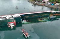 A RORO vessel tilts to one side while docked at the Port of Real in Quezon province. According to the Philippine Coast Guard, the MV Virgen de Peñafrancia carried at least 58 passengers and crew and they were reported rescued from the vessel which was also carrying at least 1,300 liters of marine diesel in its service tank.