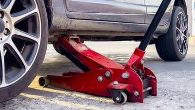 Tire repairman killed after dump truck jack slips