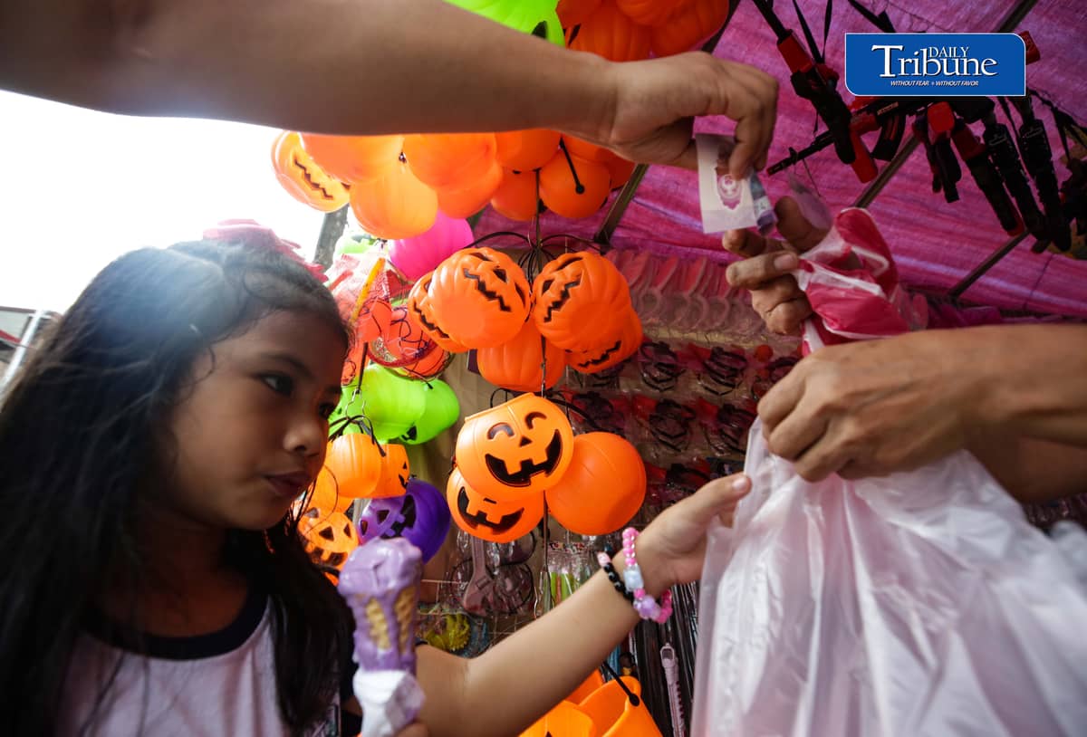 Vendors tend their customers buying Halloween trick or treat baskets for their kids to use for Halloween celebrations, observed annually on 31 October, dedicated to remembering the dead, before the All Saints Day and All Souls Day celebration.