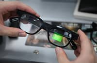 AN optometrist holds a pair of smart glasses at the Eyedaq eyewear store in Seoul on 30 October 2026.