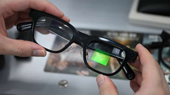 AN optometrist holds a pair of smart glasses at the Eyedaq eyewear store in Seoul on 30 October 2026.