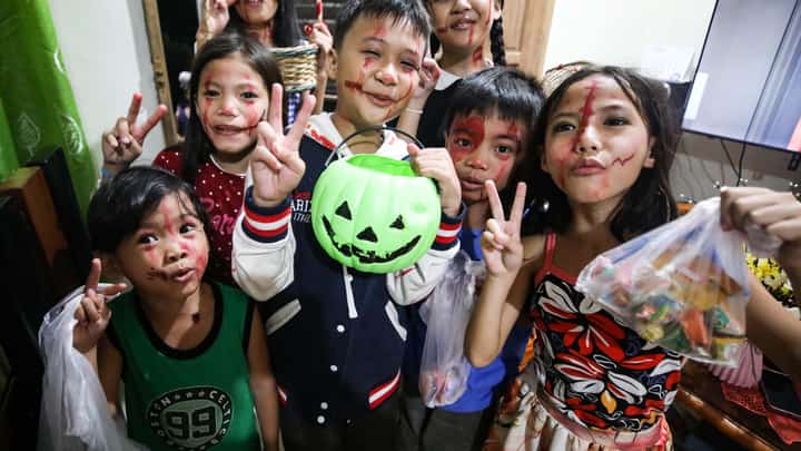 (31 October 2026) Kids are seen happily carrying Halloween baskets and plastic bags for trick-or-treating during the Halloween celebration on Saturday night, 31 October 2026, in Caloocan North. Halloween is an annual celebration observed on October 31 that marks the evening before All Souls’ Day and All Saints' Day. Photo/Analy Labor