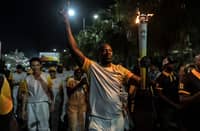 FRENCH actor Omar Sy carries the Olympic flame signaling the start of the 4th Youth Olympic Games, the first ever Olympic Games that will be held on African soil.