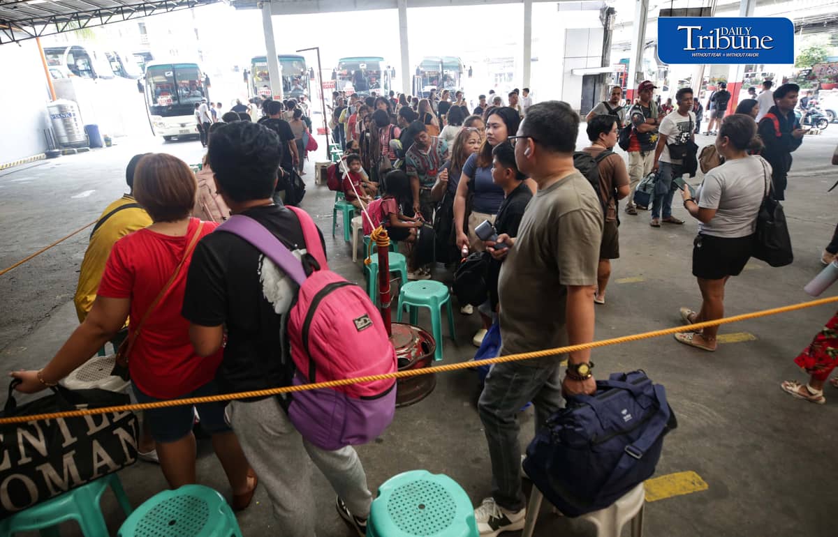 (October 31 2026) Passengers queue as they wait for the bus to ride to their Provinces, to spend a long weekend and to visit their departed loved ones, at the Bus terminal in Quezon City on Saturday October 31 2026. Photo/Analy Labor