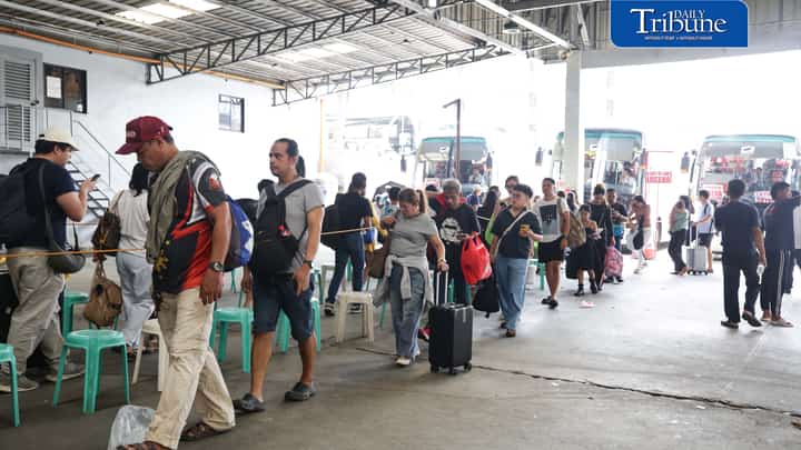 Passengers line up at a bus terminal in Quezon City on Saturday, Oct. 31, as Filipinos head to their home provinces for the long Undas weekend.
Travelers prepare to spend time with their families and visit the graves of their departed loved ones in observance of All Saints' Day and All Souls' Day.