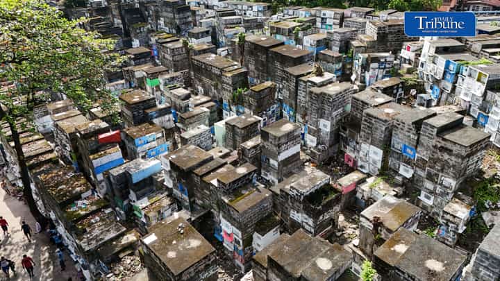 Families visit the graves of their departed loved ones at Barangka Cemetery in Marikina City on Saturday, Oct. 31, ahead of All Saints' Day and All Souls' Day.
Some choose to visit early to avoid the expected crowds during the annual Undas observance.
Photo by Analy Labor