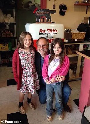 Doug Hayes with his grand daughters