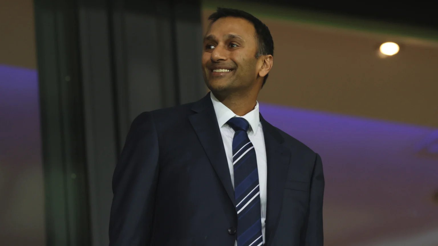 West Brom chairman Shilen Patel smiles while in the stands